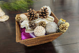 Decorative basket with Christmas ornaments on a wooden surface