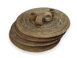 Set of woven placemats with napkin ring holders on a white background