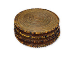 Stack of round woven placemat with a white background