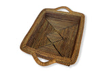 Woven brown basket with handles on a white background